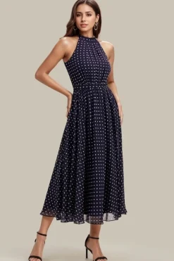 Robe de cocktail bleu marine à pois sans manches col licou