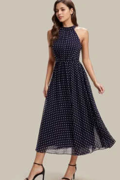 Robe de cocktail bleu marine à pois sans manches col licou