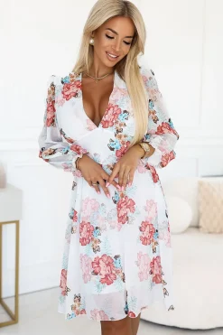 Robe de cocktail fleurie manches longues chic