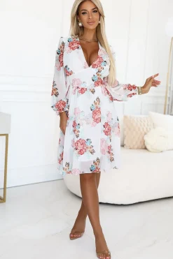 Robe de cocktail fleurie manches longues chic