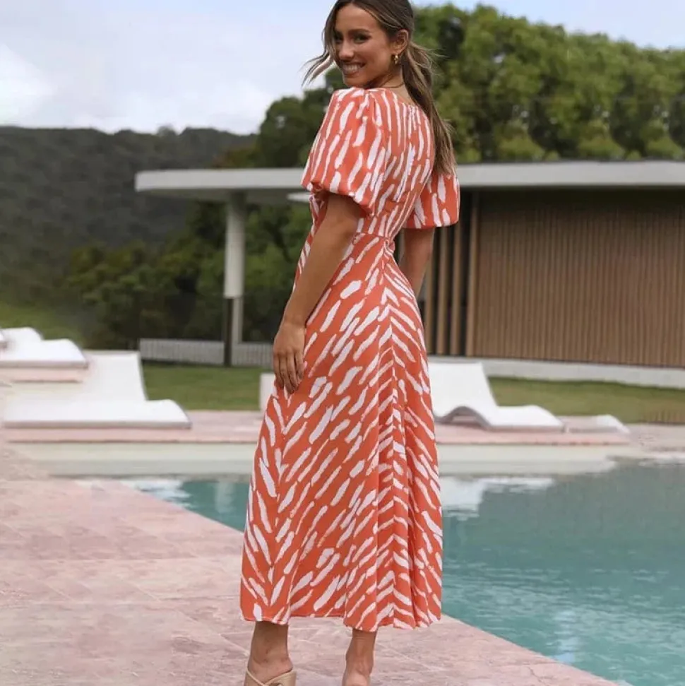 Robe de cocktail orange midi manches bouffantes