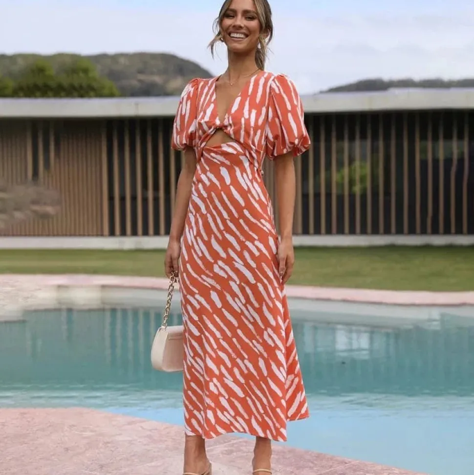 Robe de cocktail orange midi manches bouffantes