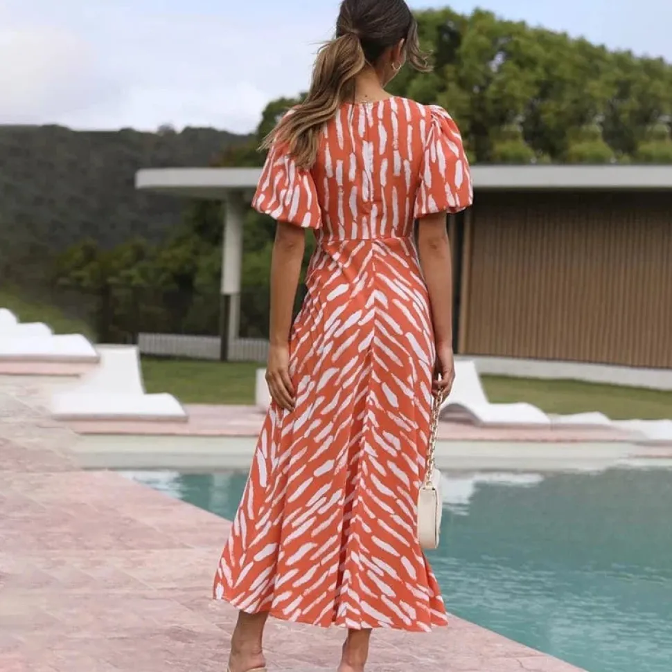 Robe de cocktail orange midi manches bouffantes