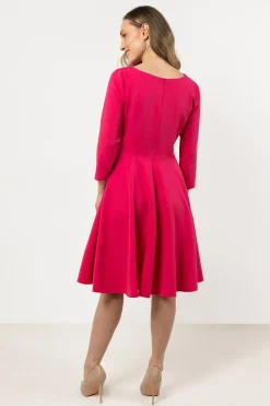 Robe de cocktail rose évasée manches longues